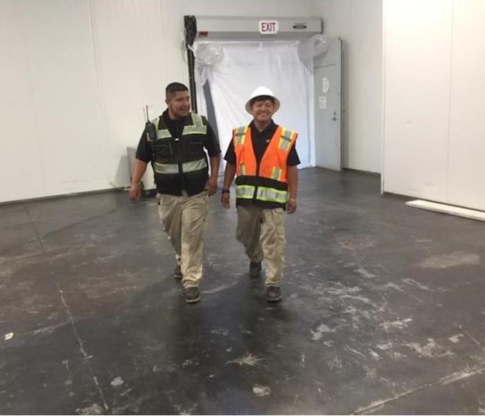 SERVPRO Project Managers Walking Empty Retail Location
