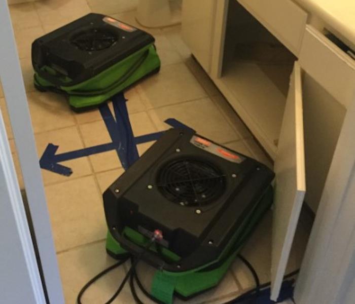 Water Damaged Bathroom with SERVPRO equipment 