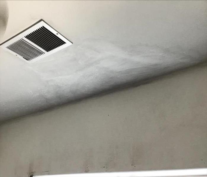 A ceiling with smoke damage